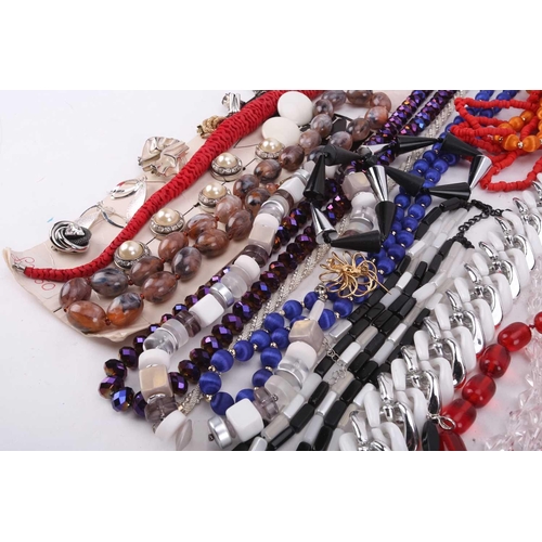 30 - A large quantity of costume jewellery including six sleeve garters, various buttons, beaded necklace... 