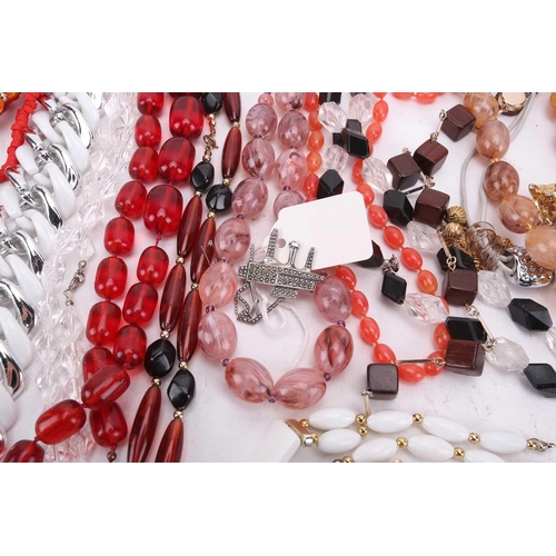 30 - A large quantity of costume jewellery including six sleeve garters, various buttons, beaded necklace... 