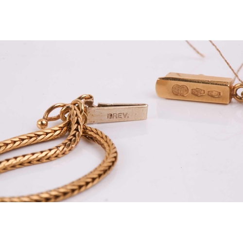 300 - A three-strand chain necklace, the foxtail link chains graduating in length from 62cm to 68cm, with ... 