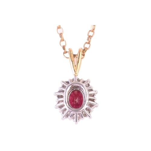 303 - A ruby and diamond cluster pendant, the central ruby measuring 5.7 x 5.2mm, encircled by round brill... 