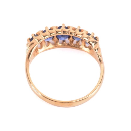 305 - A sapphire and diamond five-stone ring, set with a graduated row of five sapphires, the largest meas... 