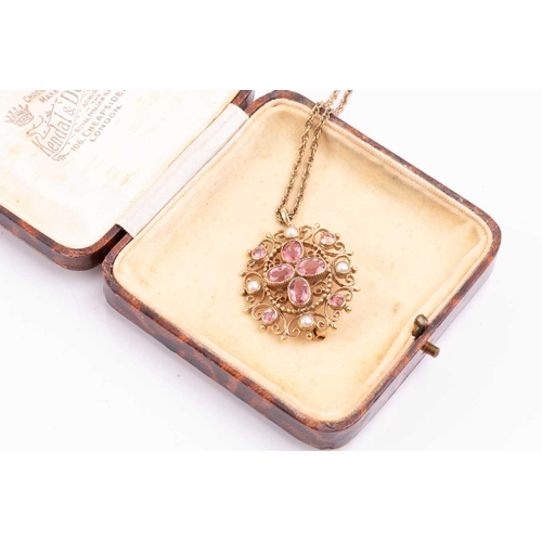 315 - A tourmaline and seed pearl pendant/brooch with a scrolling filigree mount, measuring 34mm x 30mm, w... 