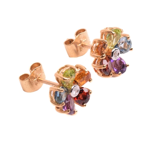 316 - A multi-gem floral cocktail ring and matching earrings; the five-petal flowerhead is composed of ova... 