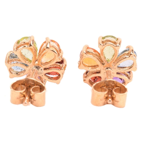 316 - A multi-gem floral cocktail ring and matching earrings; the five-petal flowerhead is composed of ova... 