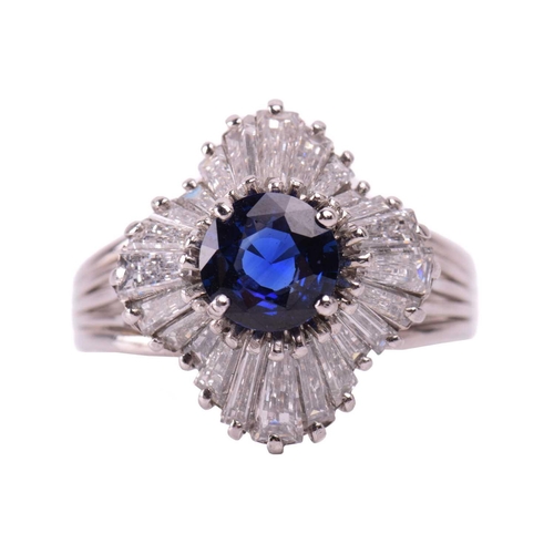 270 - A sapphire and diamond dress ring, centred with a circular-cut sapphire of bright blue colour, appro... 