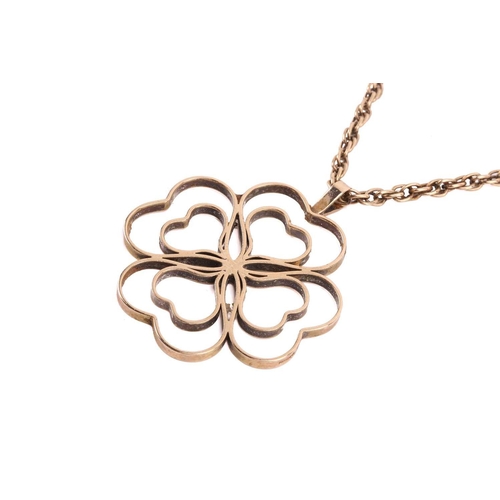 293 - A gold quartrefoil pendant, in the form of a four leaf clover measuring 44mm wide, with English hall... 