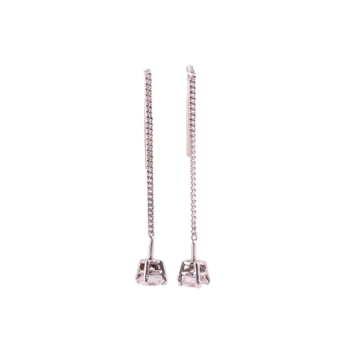 296 - A pair of diamond set drop earrings, featuring two claw set round brilliant cut diamonds measuring 4... 