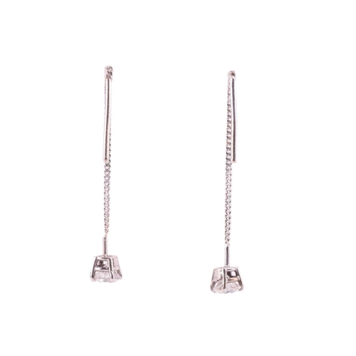 296 - A pair of diamond set drop earrings, featuring two claw set round brilliant cut diamonds measuring 4... 