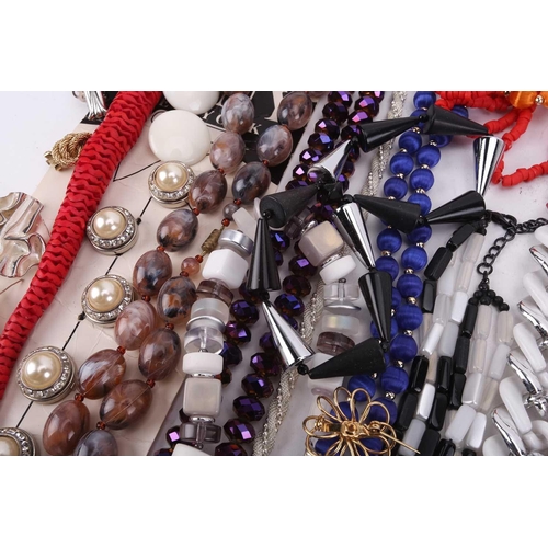 30 - A large quantity of costume jewellery including six sleeve garters, various buttons, beaded necklace... 