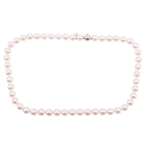 302 - Mikimoto. A slightly graduated cultured pearl necklace to an 18-carat white gold and diamond ball cl... 