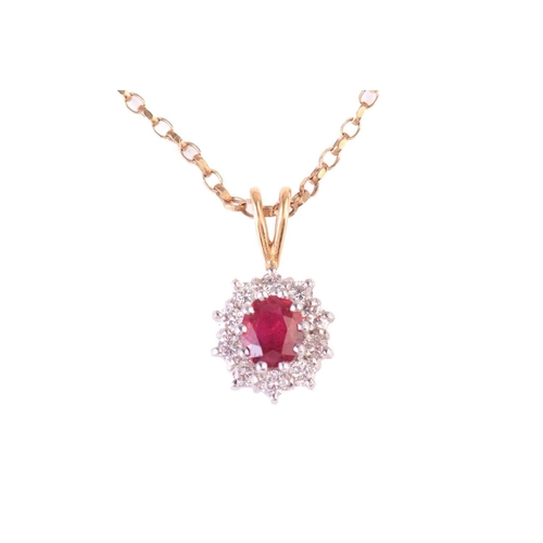 303 - A ruby and diamond cluster pendant, the central ruby measuring 5.7 x 5.2mm, encircled by round brill... 