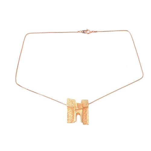 311 - Georg Jensen - a gilt 'Sunshine & Night' pendant on chain, a stylised and textured structure with ar... 