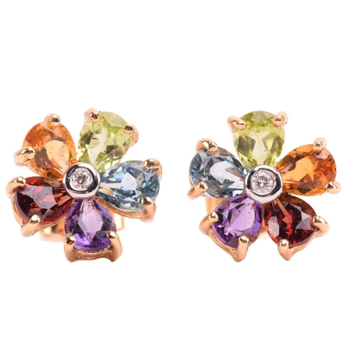 316 - A multi-gem floral cocktail ring and matching earrings; the five-petal flowerhead is composed of ova... 