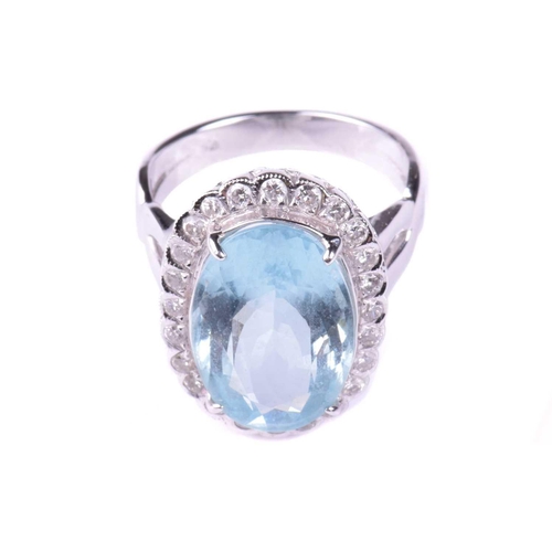 318 - An aquamarine and diamond cluster ring, set with an aquamarine measuring 16.2mm x 10.8mm, encircled ... 