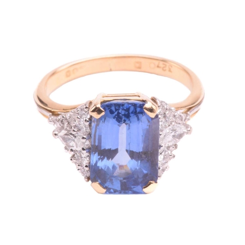 320 - A sapphire and diamond ring, set with a central sapphire with an estimated weight of 4.25ct, measuri... 