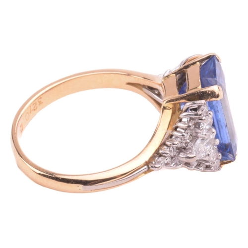 320 - A sapphire and diamond ring, set with a central sapphire with an estimated weight of 4.25ct, measuri... 