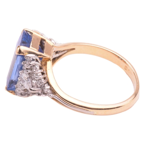 320 - A sapphire and diamond ring, set with a central sapphire with an estimated weight of 4.25ct, measuri... 