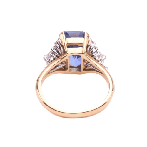 320 - A sapphire and diamond ring, set with a central sapphire with an estimated weight of 4.25ct, measuri... 