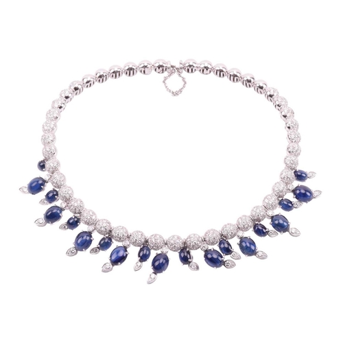 323 - A diamond and sapphire fringe choker by Stefan Hafner, comprising a flexible wire connecting graduat... 