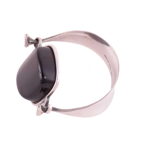 325 - Georg Jensen - a tension clamp opening smoky quartz bangle, with a cushion-shaped smoky quartz block... 