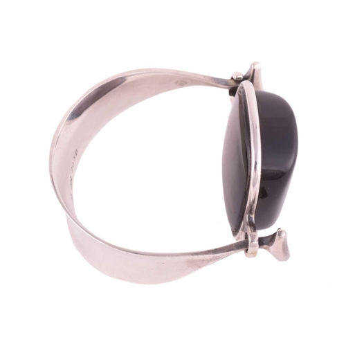 325 - Georg Jensen - a tension clamp opening smoky quartz bangle, with a cushion-shaped smoky quartz block... 