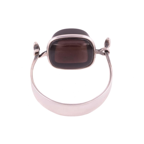 325 - Georg Jensen - a tension clamp opening smoky quartz bangle, with a cushion-shaped smoky quartz block... 