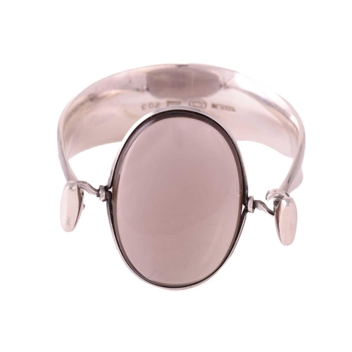 327 - Georg Jensen - 'Arm Ring' with smokey quartz, a tension clamp opening bangle with an oval panel of p... 