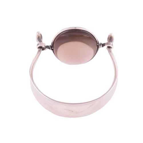 327 - Georg Jensen - 'Arm Ring' with smokey quartz, a tension clamp opening bangle with an oval panel of p... 