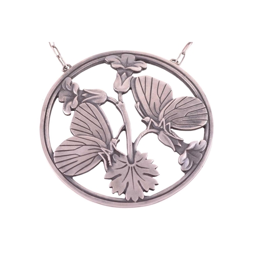 329 - Georg Jensen - a butterfly necklace, the round pendant depicting two butterflies resting upon bellfl... 