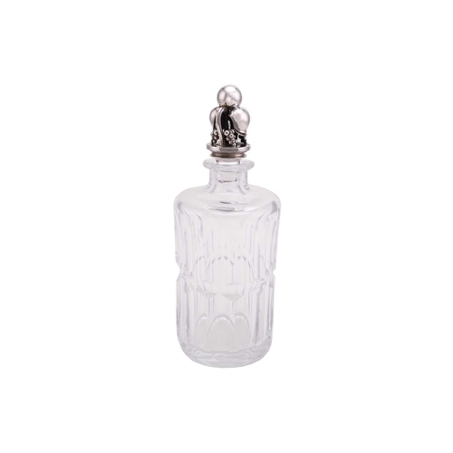 335 - Georg Jensen. A silver-mounted cut glass decanter, the cylindrical panelled glass bottle with cast s... 