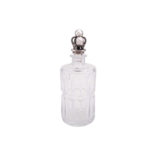 335 - Georg Jensen. A silver-mounted cut glass decanter, the cylindrical panelled glass bottle with cast s... 