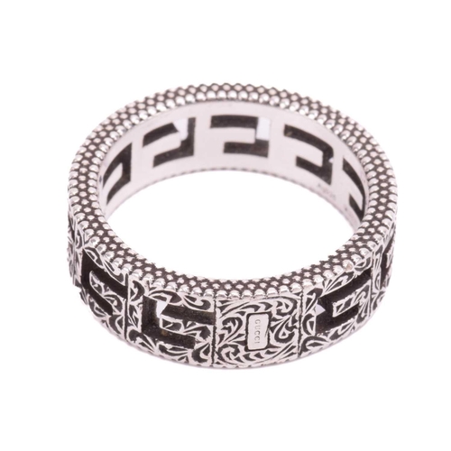 36 - Gucci - a silver ring in 'Square G' cut-out design, embellished with Arabesque-style engravings and ... 