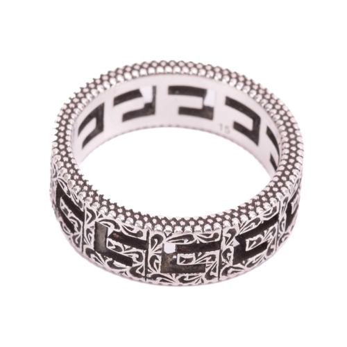 36 - Gucci - a silver ring in 'Square G' cut-out design, embellished with Arabesque-style engravings and ... 