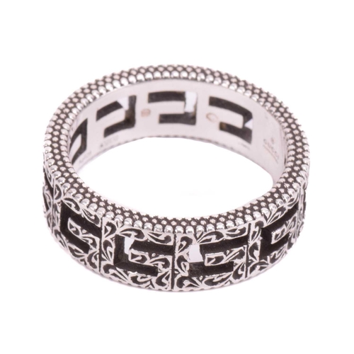 36 - Gucci - a silver ring in 'Square G' cut-out design, embellished with Arabesque-style engravings and ... 