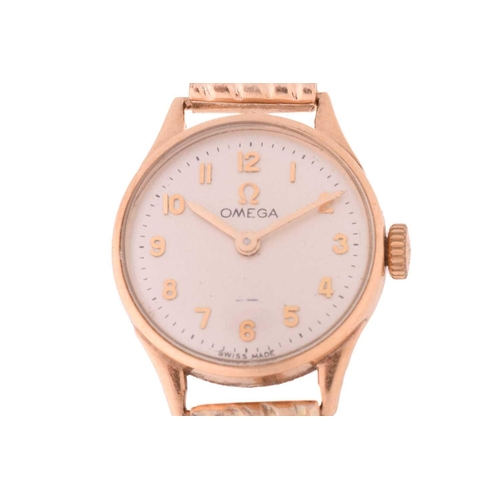 433 - An Omega lady's dress watch in 9ct gold, featuring a Swiss-made hand-wound mechanical movement in a ... 