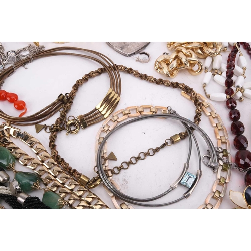 45 - A large collection of costume jewellery including various base metal chains, beaded necklaces, clip-... 