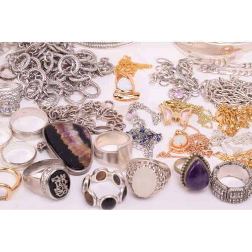 37 - A collection of white metal jewellery including various bangles, bracelets, rings and necklaces with... 