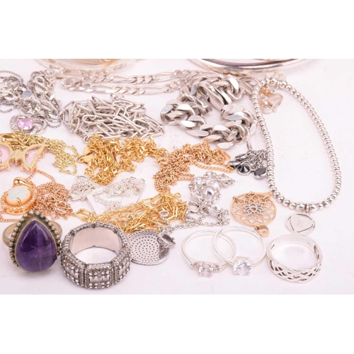 37 - A collection of white metal jewellery including various bangles, bracelets, rings and necklaces with... 