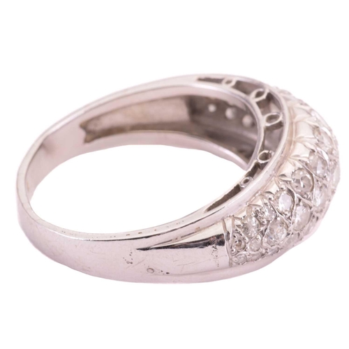 4 - A diamond dress ring, designed as a half hoop set throughout with three rows of round brilliant cut ... 