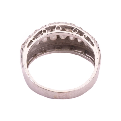 4 - A diamond dress ring, designed as a half hoop set throughout with three rows of round brilliant cut ... 