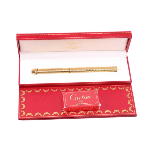 401 - Les Must de Cartier - two boxed 'Vendôme Trinity' pens of crosshatch pattern; containing one fountai... 