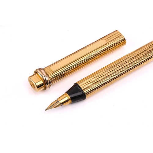 401 - Les Must de Cartier - two boxed 'Vendôme Trinity' pens of crosshatch pattern; containing one fountai... 