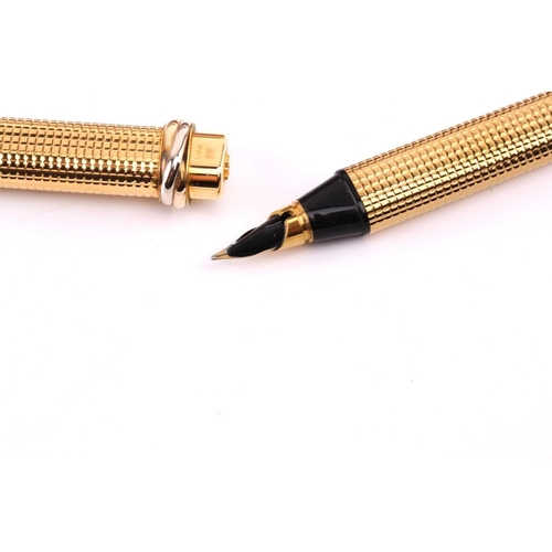 401 - Les Must de Cartier - two boxed 'Vendôme Trinity' pens of crosshatch pattern; containing one fountai... 