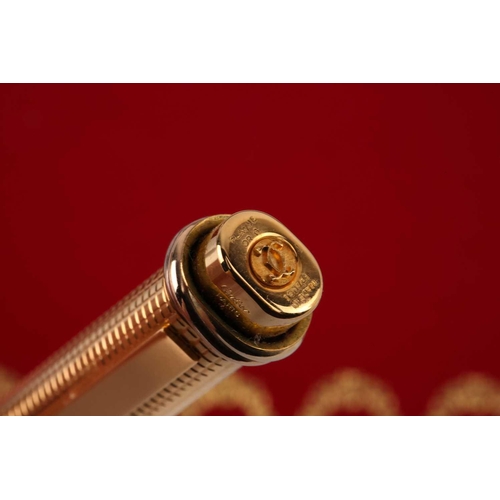 401 - Les Must de Cartier - two boxed 'Vendôme Trinity' pens of crosshatch pattern; containing one fountai... 