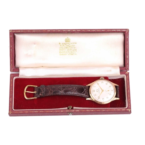 464 - A Garrard & Co. 9ct gold dress watch featuring a Swiss-made hand-wound movement in a yellow gold 9ct... 