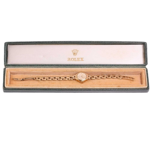 465 - A Rolex lady's dress watch in 9ct gold, featuring a Swiss-made hand-wound movement calibre: 1300 in ... 