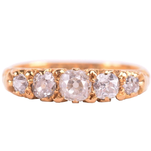 5 - A Victorian diamond five-stone carved half hoop ring, circa 1898, set with a row of cushion shape ol... 