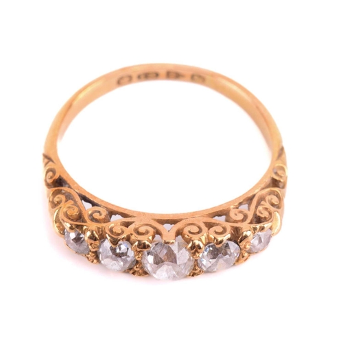 5 - A Victorian diamond five-stone carved half hoop ring, circa 1898, set with a row of cushion shape ol... 