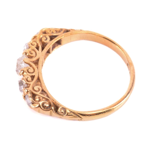 5 - A Victorian diamond five-stone carved half hoop ring, circa 1898, set with a row of cushion shape ol... 