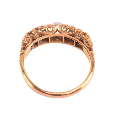 5 - A Victorian diamond five-stone carved half hoop ring, circa 1898, set with a row of cushion shape ol... 